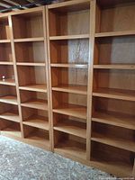 Full front view showing four-column bookcase, shelving layout and wood finish