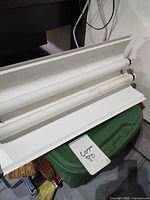 Fixture face with two fluorescent tubes installed
