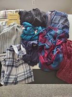 Top view of all 10 garments spread out on table