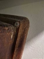 Top corner showing wood grain and screw