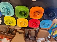Top view showing all eight colored plate, bowl and cup sets