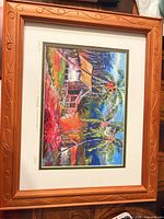 Full view of framed tropical print showing frame design and mat