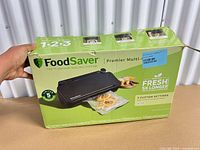 Front of original FoodSaver Premier Multi-Use box showing product image and branding