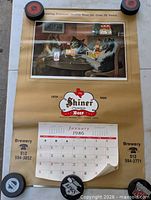 Full view of calendar with artwork and January 1986 page
