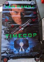 Full view of poster front with Van Damme image and title