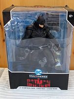 Front of sealed box showing Batman statue and DC Multiverse branding