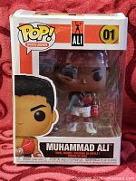 Front view of boxed Muhammad Ali Funko Pop showing figure and box graphics