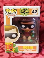 Front view of boxed Funko Pop Robin #42