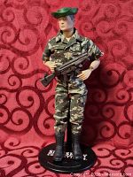 Full-length view of GI Joe figure on stand with all accessories visible