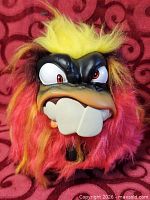 Front view of Grumblies toy showing fur colors, face, teeth and eyes