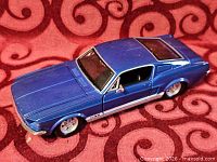 Top and side view of blue 1967 Mustang GT model
