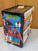 Side view of sealed Spawn Evolution box showing graphics and Spawn 1 label