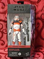 Front view of boxed Imperial Clone Shock Trooper figure with accessories visible