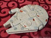Top view of Millennium Falcon handheld game showing sculpted details and paint