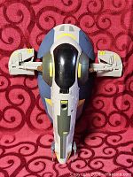Top view of Slave I starship toy showing overall shape