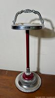 Full view of standing ashtray showing height, base and handle