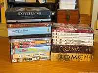 Full lot showing two stacks of DVD boxsets