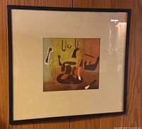 Framed abstract print on wall
