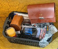 Overall view of plastic basket containing shoe care items