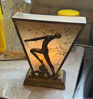Front view showing dancer silhouette illuminated