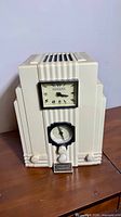 Front view of Spirit of St. Louis skyscraper-style radio clock