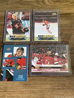 Front view of all four Upper Deck UD Canvas hockey cards in sleeves
