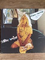 Front of Kim Carnes "Mistaken Identity" album jacket showing artwork and hype sticker