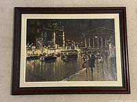 Full view of framed painting showing Paris night street scene