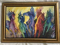Full view of framed multicolored horse painting