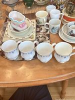 Overview of four Royal Albert blue floral bone china cups on table