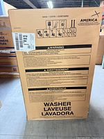 Front of sealed Whirlpool washer carton with warning text and bilingual washer labeling