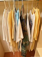 Row of T-shirts in assorted colors on hangers