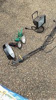 Group view of desk lamp, flood light, and two stake spotlights on ground