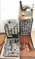 overall lot view showing organizers, socket set and sharpening items