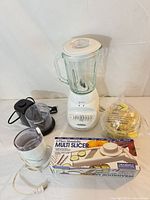 Group shot of all five kitchen appliances and boxed slicer
