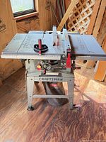 Front view of Craftsman table saw showing brand badge, 3.0 label, rip fence and dust bag