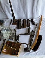 overview of cobbler stand, shoe lasts, brace drill, auger bits, brush, broom, screwdriver set