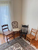 Group shot of four assorted antique chairs
