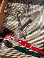 Drawer with apple slicer, knife sharpeners, paring knives