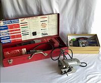 Full lot view: Milwaukee Sawzall in red case, jigsaw, rotary tool kit