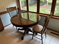 Table and two chairs by window