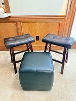 Group shot of two stools and cube ottoman