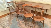 All four Windsor chairs grouped showing mix of arm and side chairs