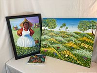 Group shot of all three paintings: large Baptiste landscape, framed portrait, small Bollard canvas