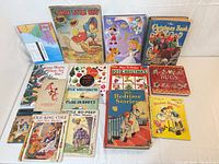Spread of 14 vintage children’s books laid flat