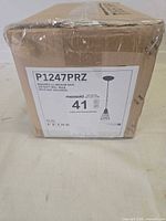 Box showing model P1247PRZ label with line drawing of pendant