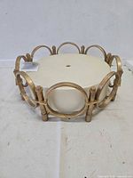 Ceiling light fixture showing antique gold metal frame and diffuser