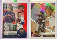 Both baseball cards in sleeves showing fronts