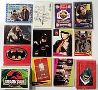 Assorted sleeved cards from multiple franchises laid out