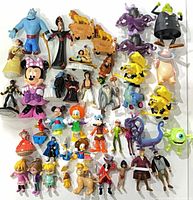 Full group view of assorted plastic Disney character figurines